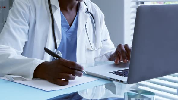 male doctor working at desk in the hospital