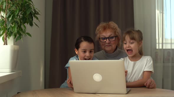 Grandmother with Granddaughter Use Laptop Learn Counting Together Home