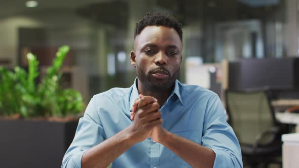 Video of focused african american businessman having video call