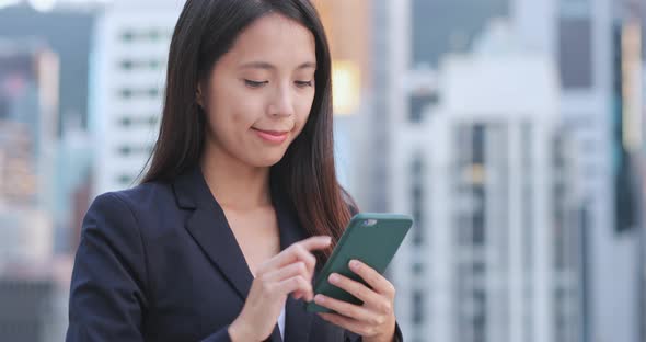 Business Woman Using Mobile Phone at Outdoor 