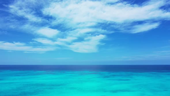 Aerial travel of luxury coast beach journey by blue water and white sand background of a dayout near