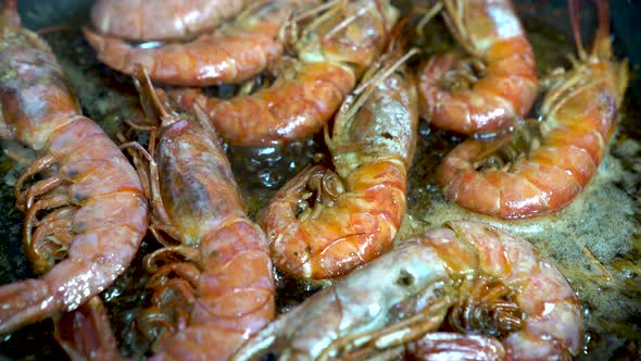 Detail shot of prawns frying in pan