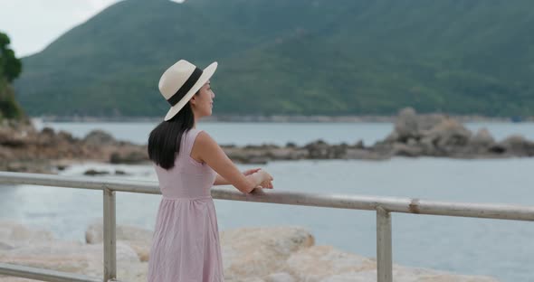 Woman look at sea at summer time