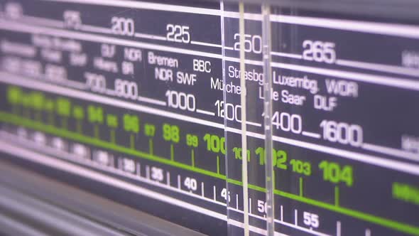 Tuning Analog Radio Dial Frequency on Scale of the Vintage Receiver