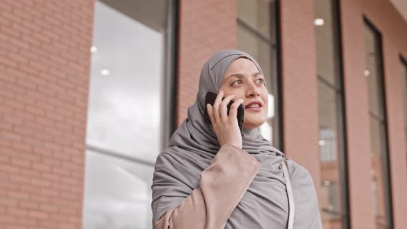 Arabic Woman Making Phone Call Outdoors