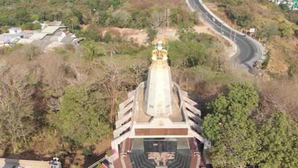 Orbiting shot of temple and meandering road, Phuket, Thailand