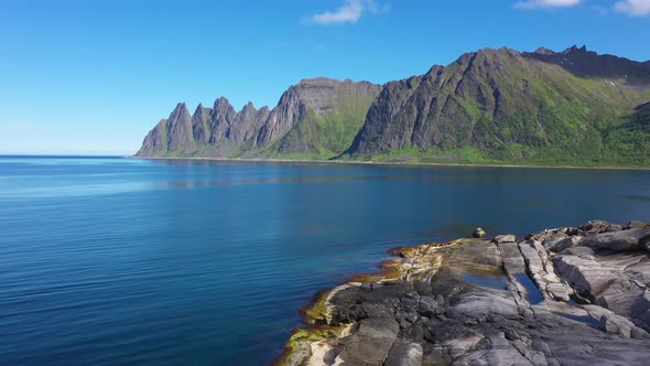 View on popular travel destination and Rock Davil’s Jaw in the sunny summer day, Norway,island Senja