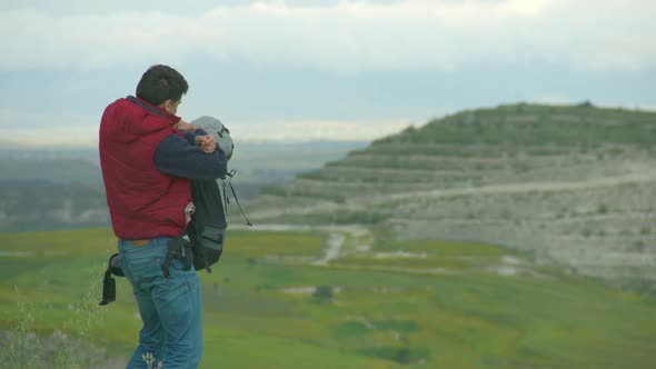 Guy Taking Off Heavy Rucksack, Breathing Fresh Air, Enjoying Amazing Landscape