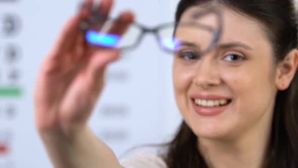 Cheerful Woman Proposing Eyeglasses, Patient Recommendation, Vision Support