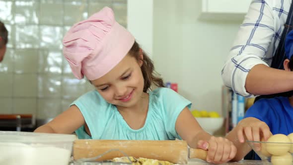 Family preparing dessert in kitchen