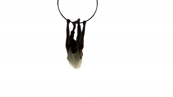 Aerial Acrobat Man on Circus Stage. Silhouette on a White Background.