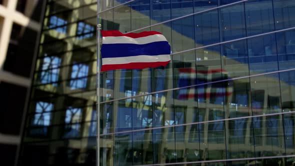 Thailand Flag Waving On A Skyscraper Building