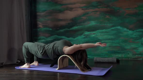 Attractive Fat Woman Performs Exercises for the Treatment of the Spine