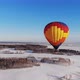 Aerial Shot of the People Fly on a Big Bright Balloon Over the Winter Forest. - VideoHive Item for Sale