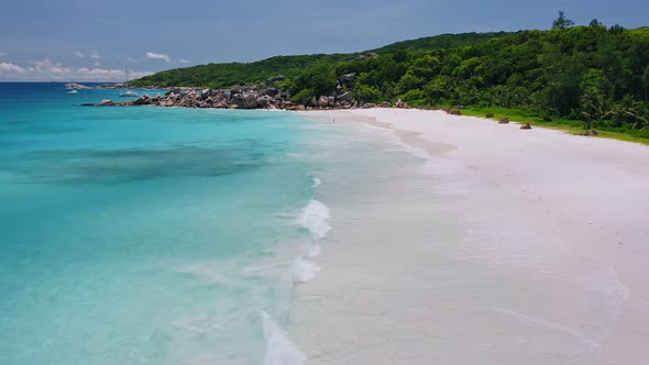 Aerial Hover Above Ocean Waves on Tropical Sandy Beach