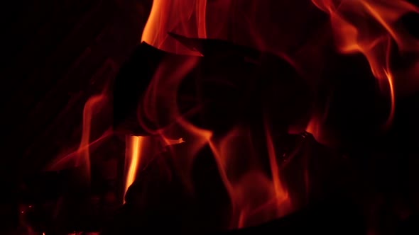 Burning Logs in Fire on Black Background in Slow Motion