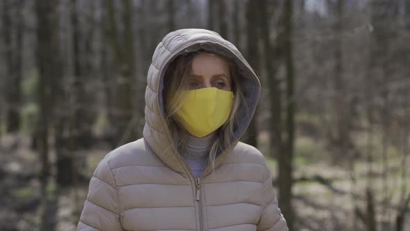 Woman in Yellow Protective Mask. Quarantine