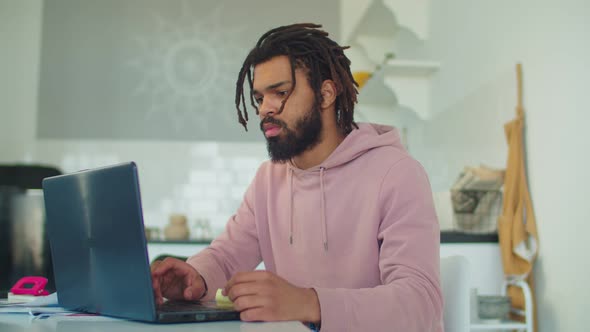 African American Man Networking with Laptop