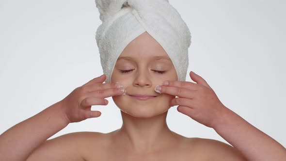 Lovely Young Child Girl Applying Cleansing Moisturizing Face Cream Skincare Natural Creme Cosmetics