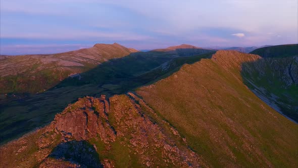 Mountain ridge on Andoya from air lit by midnight sun