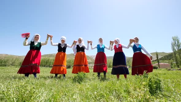 Young Women Traditionally Dancing In Traditional Clothes In Village