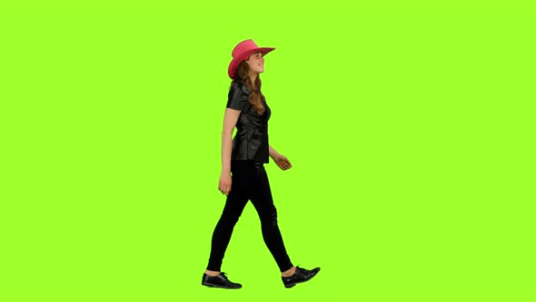 Happy Young Woman in Pink Cowboy Hat Walks on