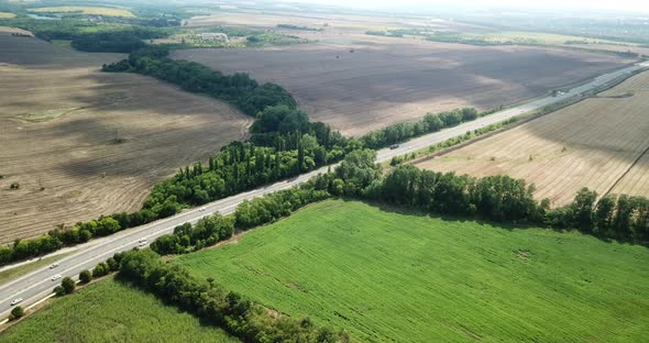 Aerial View of Endless Lush Pastures and Farmlands. Beautiful Countryside with Emerald Green Fields