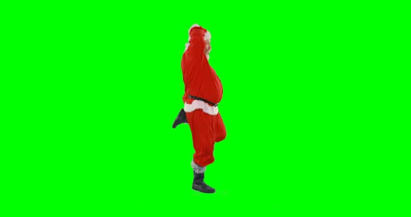 Santa claus dancing against green background 4k