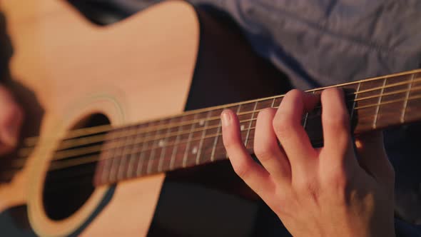 Man playing guitar with slow motion shoot music musician classic chord acoustic