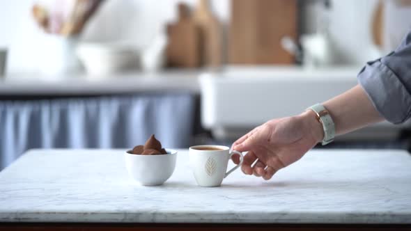 Anonymous woman with cup of fresh coffee