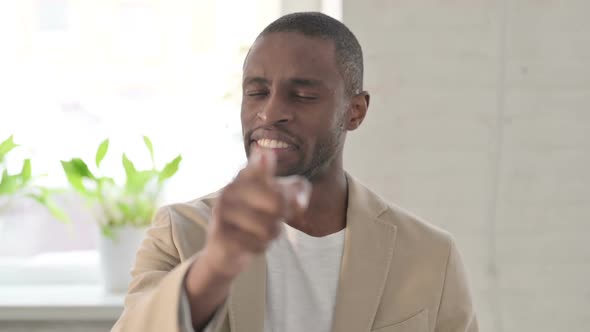 Portrait of African Man Pointing at the Camera