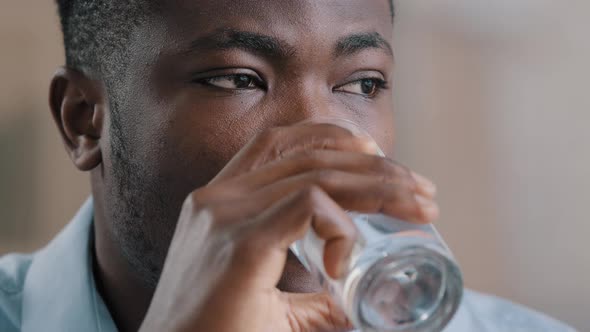 Close Up Headshot African Millennial Man Drink Pure Fresh Cold Water Glass Healthy Liquid Suffer