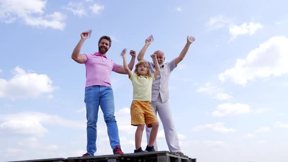 Happy Family Winners with Paper Planes Enjoy Success Making Winning Gesture Skyhigh Victory