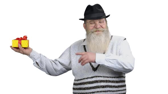 Senior Man Showing Gift Box on White Background