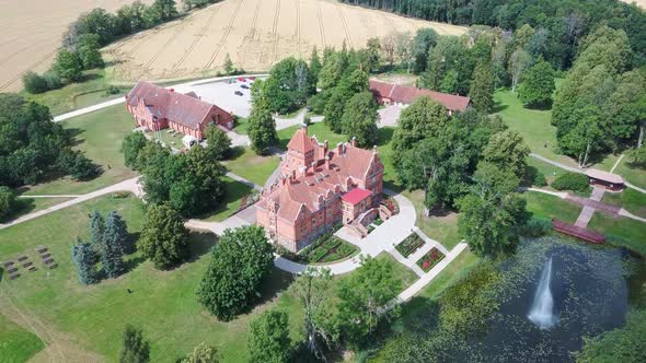 Jaunmoku Brick Medieval Castle Near Tukums, Latvia  Aerial Dron 4k Shot Jaunmokas Manor Park.