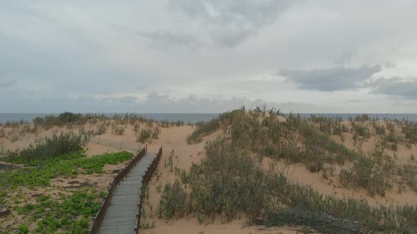 Walkway to Matadouro Beach. Aerial first-person