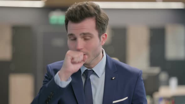 Portrait of Sick Businessman Coughing