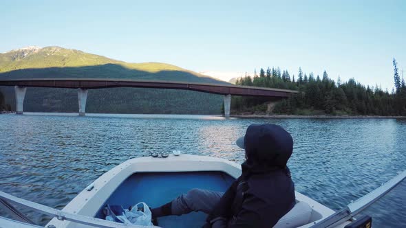 Man travelling in a boat in the river 4k