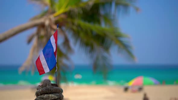 Superslowmotion Shot of a National Flag of Thailand on a Beach