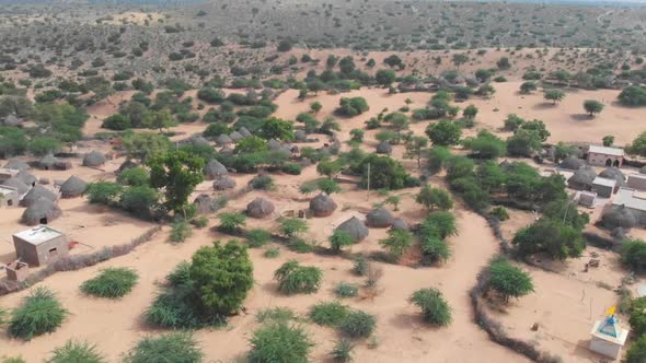 Aerial View Over Tharparkar With Rural Huts On The Ground. Tracking Shot