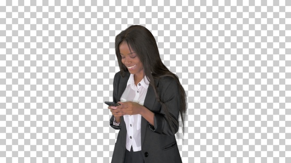 Laughing african american female texting, Alpha Channel