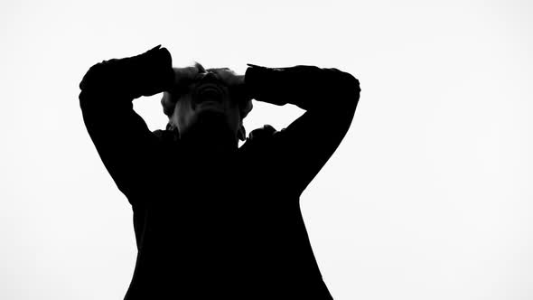 Man Silhouette Shouting in Pain After Loss of Wife, Becomes Insane Schizophrenia