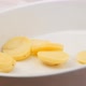 Fresh Potato Slices Falling in Oven Dish in Slow Motion - VideoHive Item for Sale