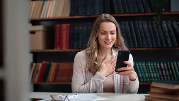 Overjoyed Professor Student Teacher Business Woman Received Good News Smartphone Message at Library