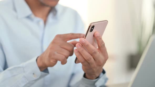 Close Up of African Man Using Smartphone