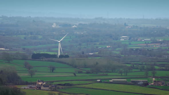 Windmill Rotating In The Countryside