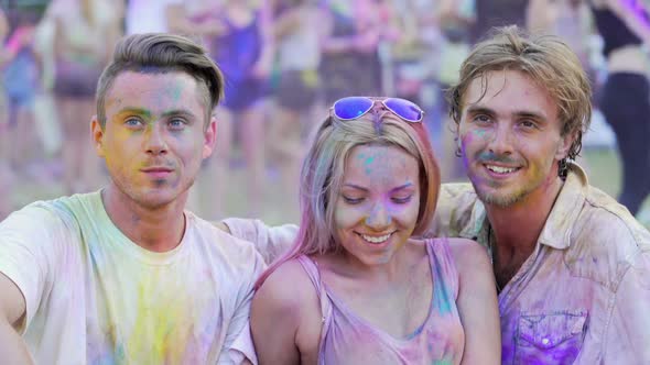 Cheerful Friends Hugging and Posing for Photo, People Having Fun at Festival