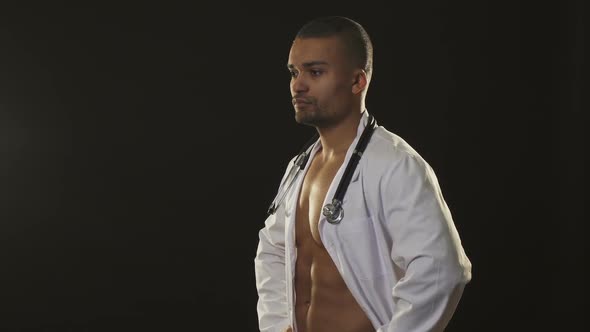 Handsome Sexy Male Doctor with Naked Muscular Torso Winking To the Camera