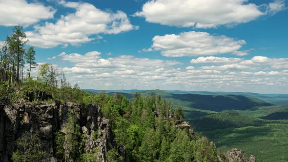 Landscape with Clouds Floating Across Sky Green Mountains