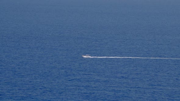 Small boat cruising through ocean